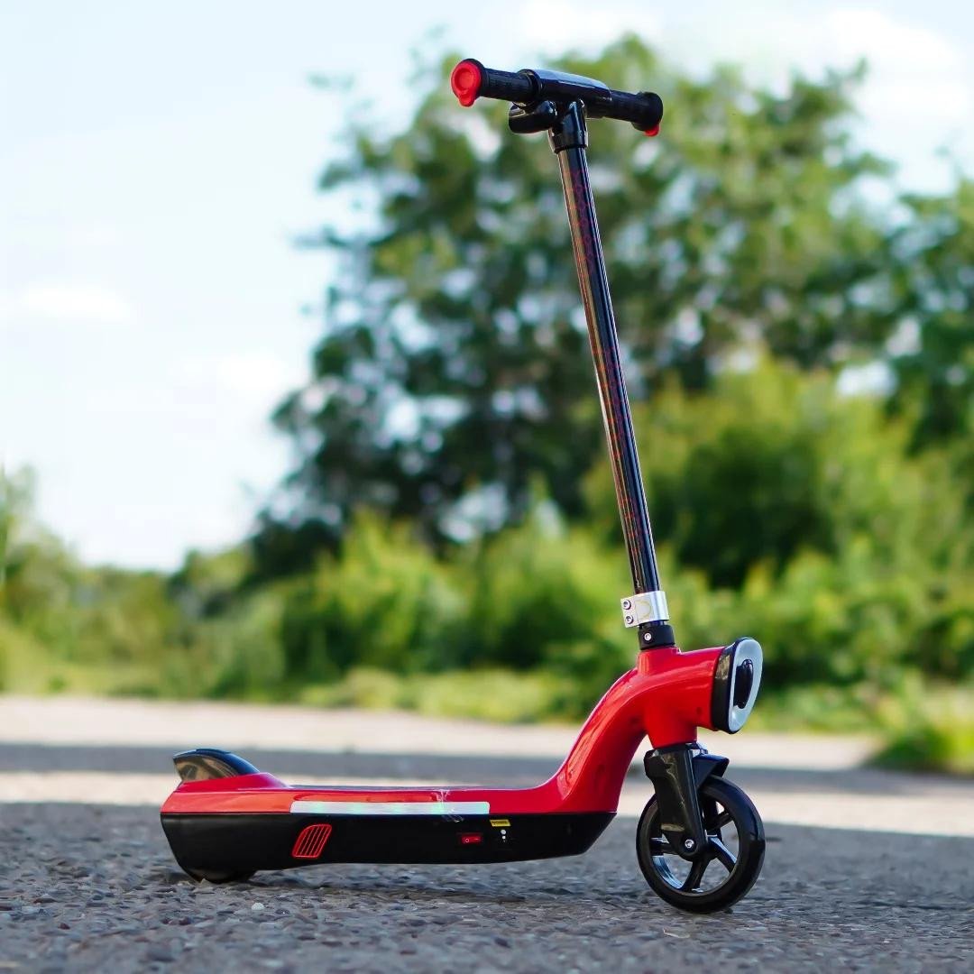 whizza-prizm-kids-12v-electric-scooter-with-flashlights-and-headlight-red__53656.1789473900.1280.1280.jpg
